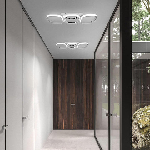 Modern interior with a wooden door and ceiling lights