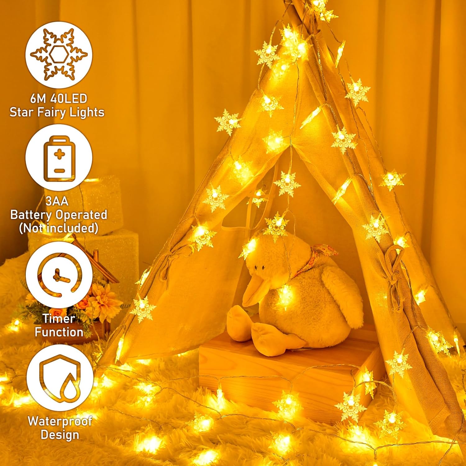 Star fairy lights with a teddy bear inside a wooden teepee against an orange curtain.