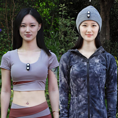 Two women wearing wireless earbuds outdoors with greenery in the background