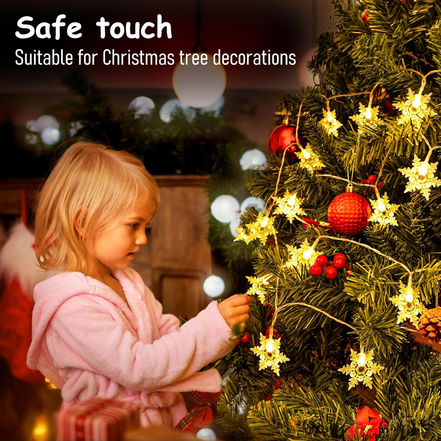 Child decorating a Christmas tree with safe touch decorations.
