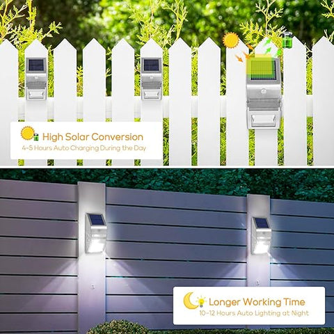 Pack of 4 LED solar security lights mounted on a fence at night

