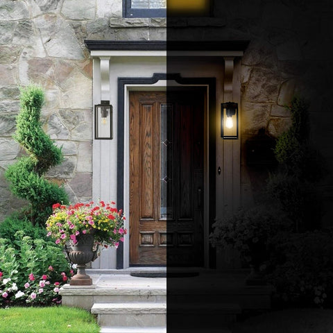 Before and after comparison of a stone house entrance with a wooden door, illuminated by outdoor lights.