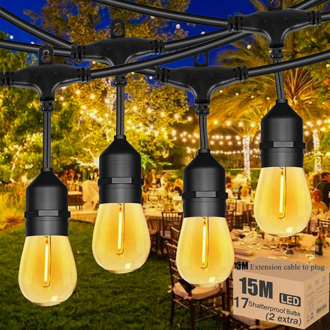 Outdoor string lights with glowing bulbs in a garden setting, featuring a box of additional LED bulbs.
