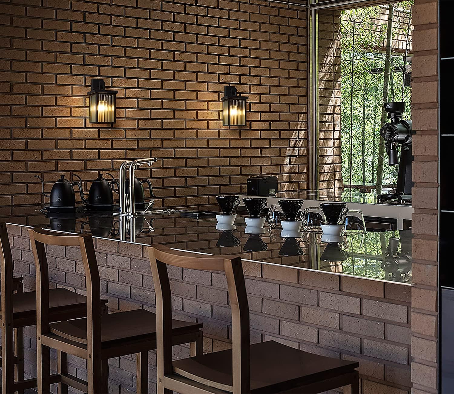 Dining area with brick wall, bar stools, and a counter.