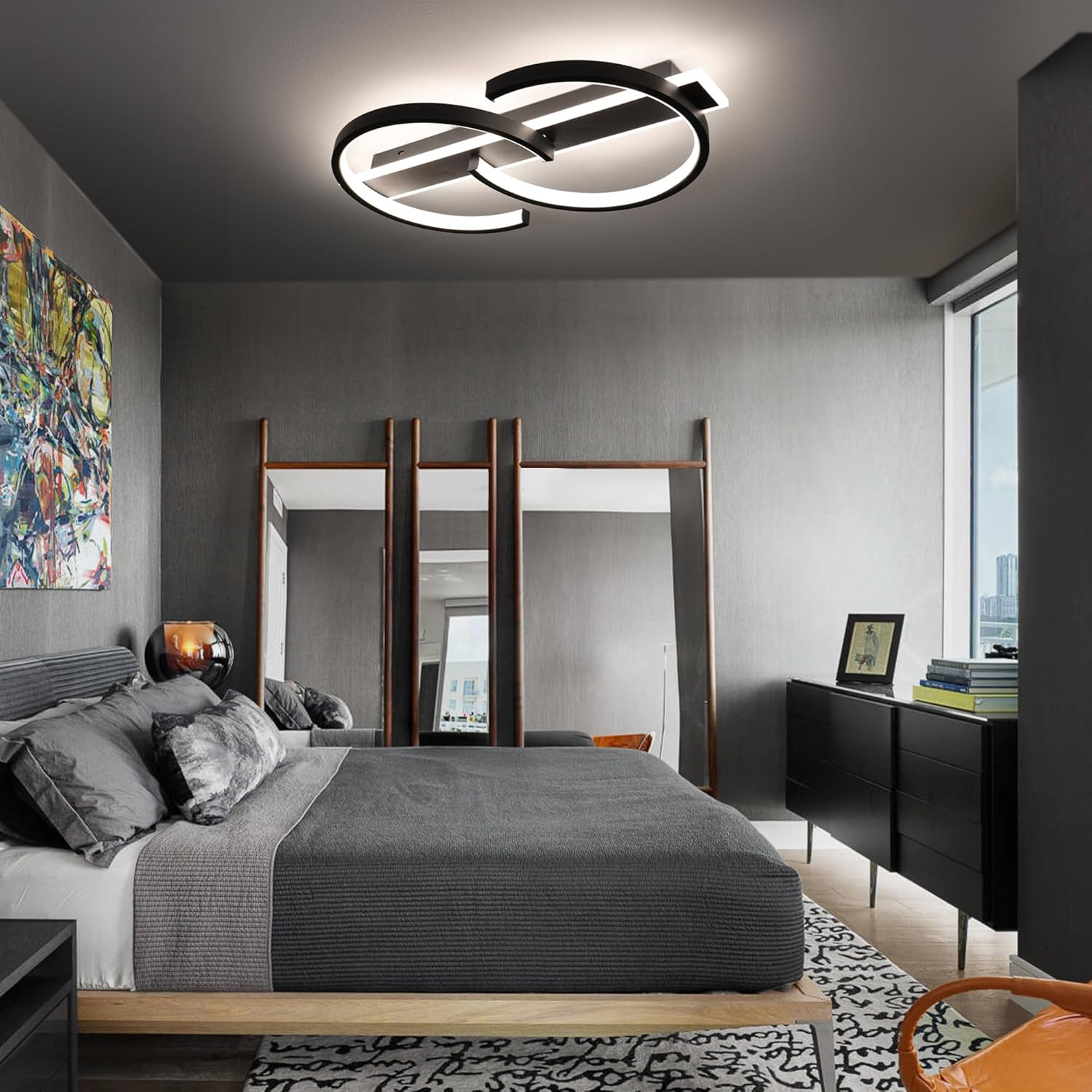 Modern bedroom with a ceiling light fixture, bed, and dresser.