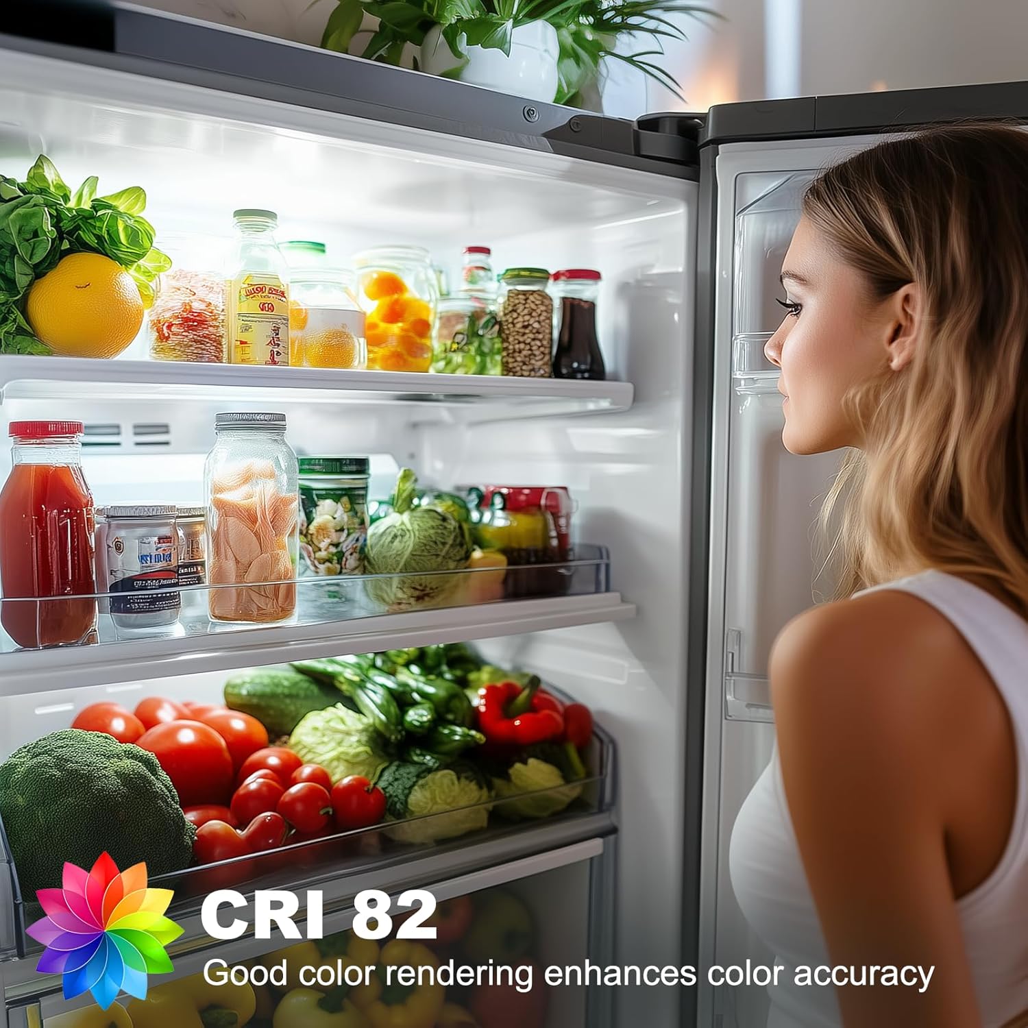 Woman looking into an open refrigerator filled with various food items, with a CRI 82 label indicating color accuracy.