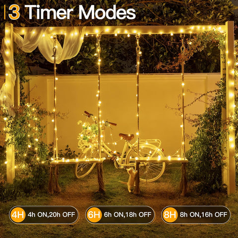 Decorative setup with a bicycle under string lights, featuring timer modes on a screen.