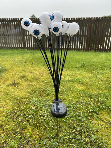 Solar Powered Halloween Eyeball Garden Lights, 12-Piece Green LED Stake Set, IP65 Waterproof Outdoor Lawn and Pathway Decorations.