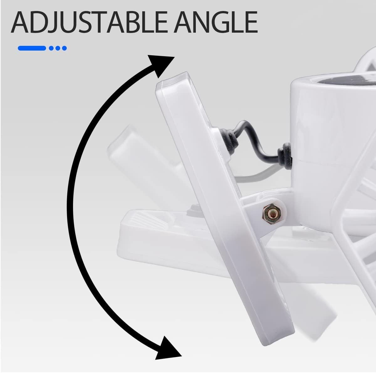 Adjustable angle feature of a white ceiling light fixture on a gray background
