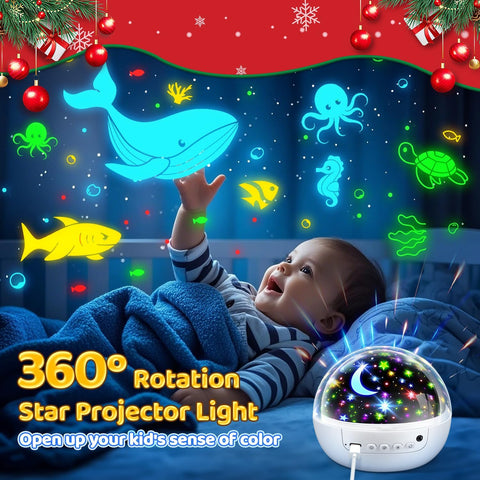 Baby lying on a bed with colorful star projector light and animated sea creatures on the wall.