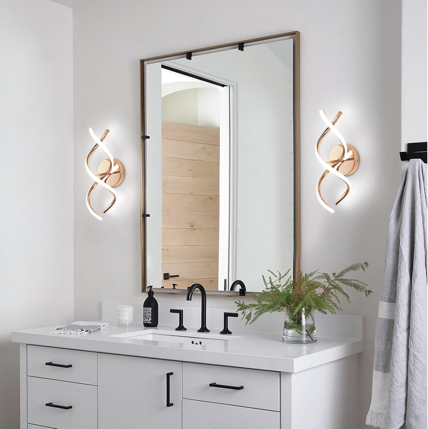 Bathroom vanity with mirror, lights, and decor