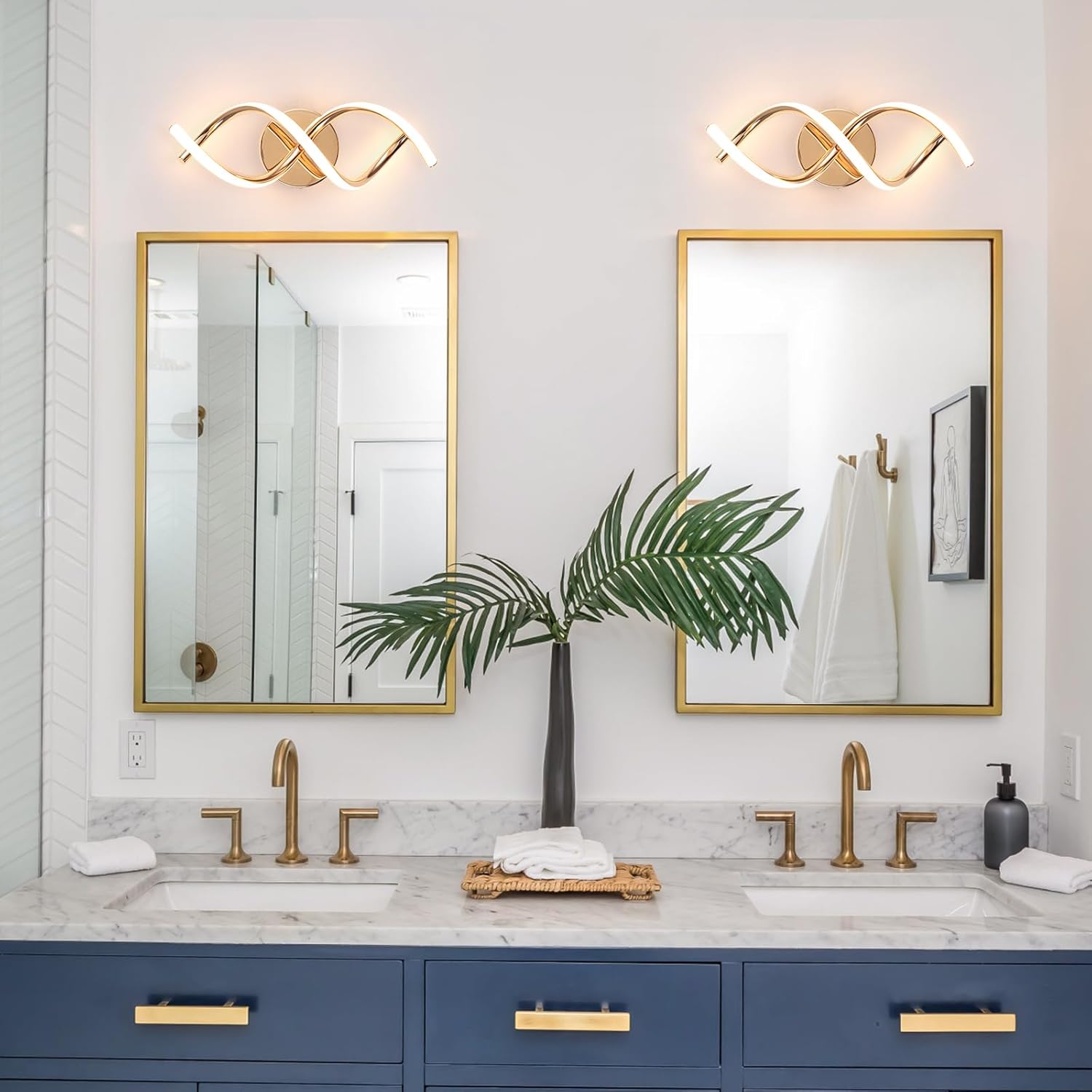 Bathroom with double vanity, gold fixtures, and decorative elements.