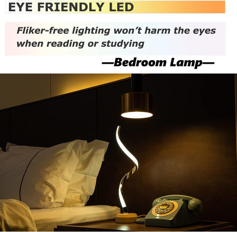 Bedroom scene with a lamp on a nightstand next to a bed, highlighting eye-friendly LED lighting.