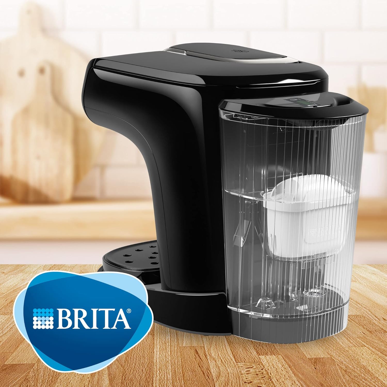 Black Brita water filter pitcher on a wooden surface with a blurred background