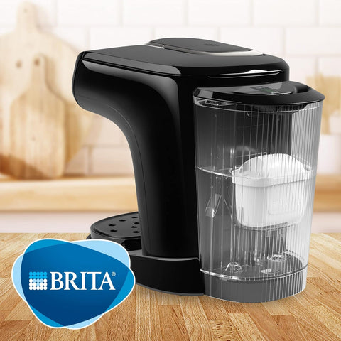 Black Brita water filter pitcher on a wooden surface with a blurred background