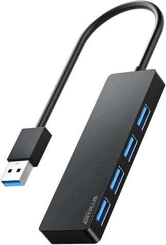 Black USB hub with multiple ports on a white background
