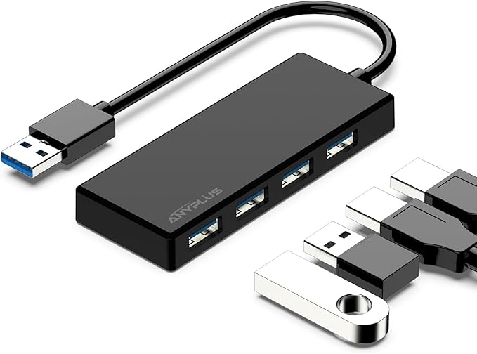 Black USB hub with multiple ports on a white background