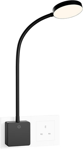 Black adjustable desk lamp with a white light on a white background
