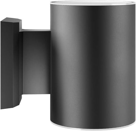 Black cylindrical wall light fixture on a white background