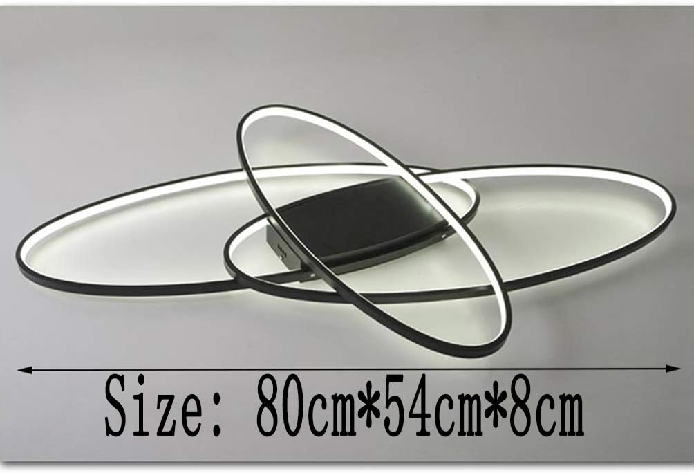 Black elliptical LED fixture above dining table

