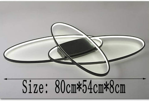 Black elliptical LED fixture above dining table

