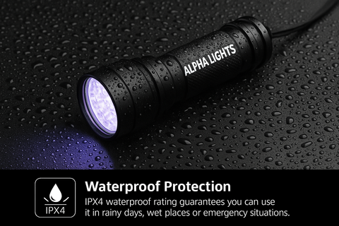 Black flashlight with 'Alpha Lights' branding on a wet surface, highlighting waterproof protection feature.
