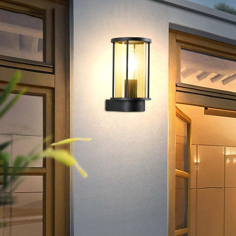 Black outdoor wall light fixture on a building exterior.