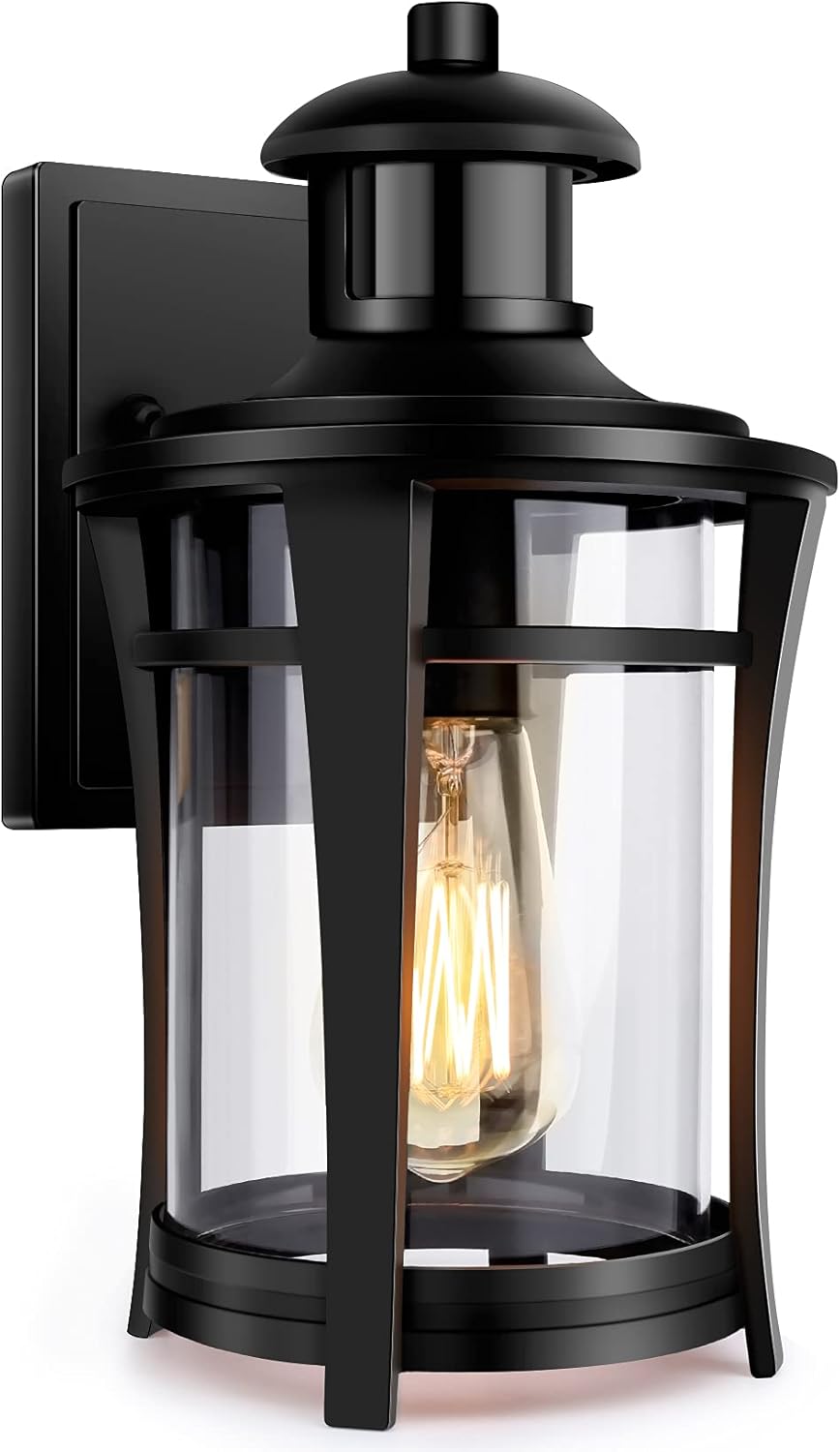 Black outdoor wall light fixture with clear glass shade on a white background