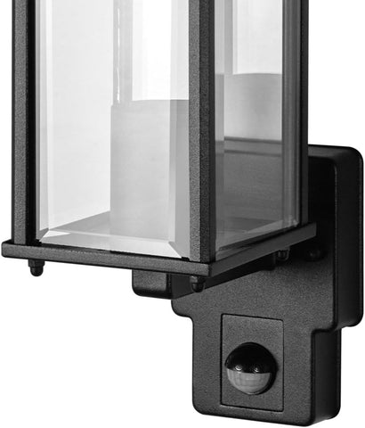Black outdoor wall light fixture with clear glass cover on a white background