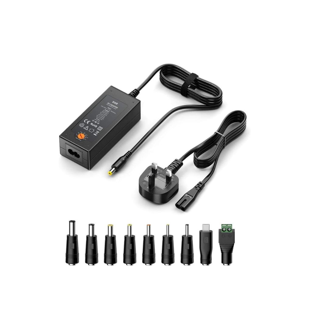 Black power adapter set with various connectors on a white background