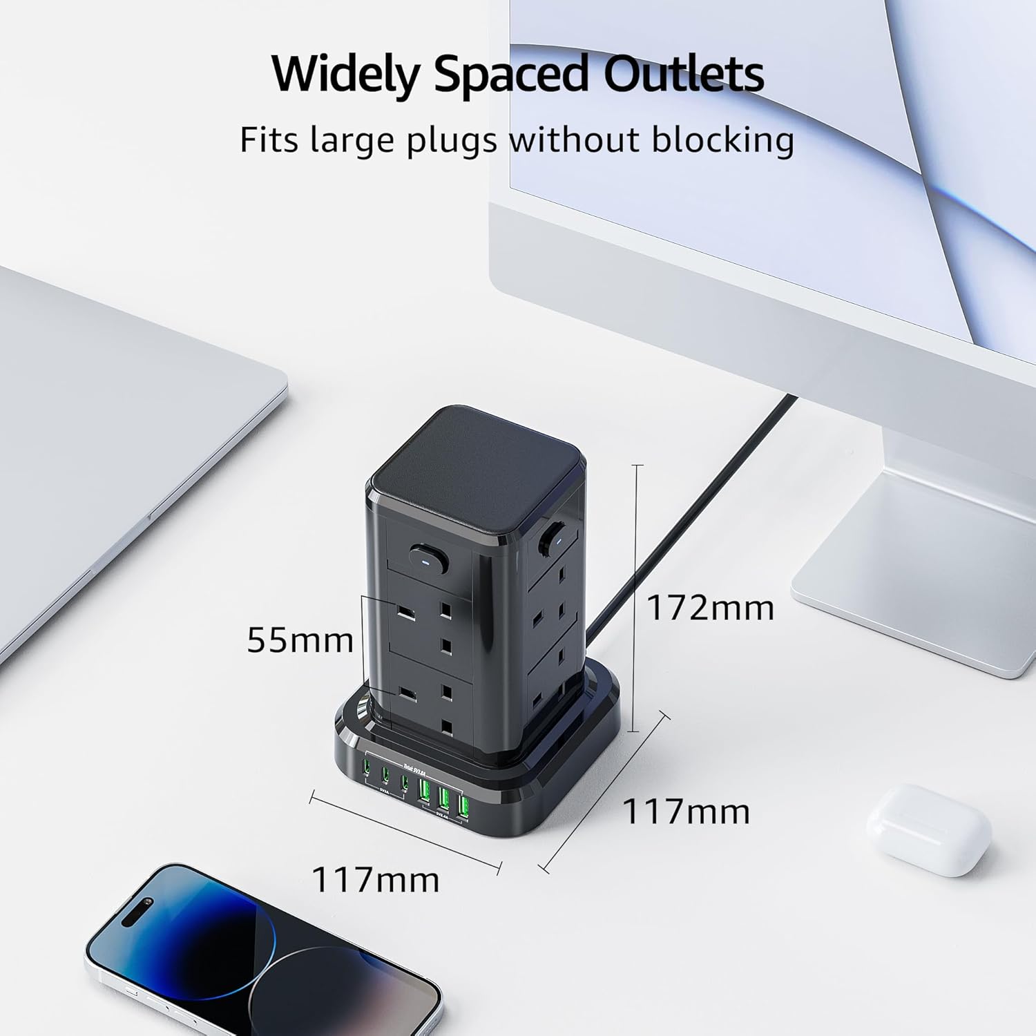 Black power strip with widely spaced outlets on a white surface with measurements indicated.
