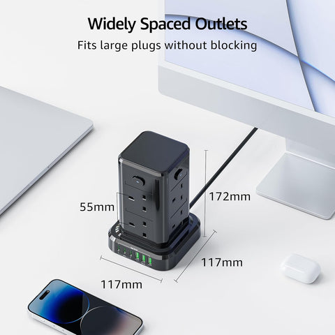 Black power strip with widely spaced outlets on a white surface with measurements indicated.