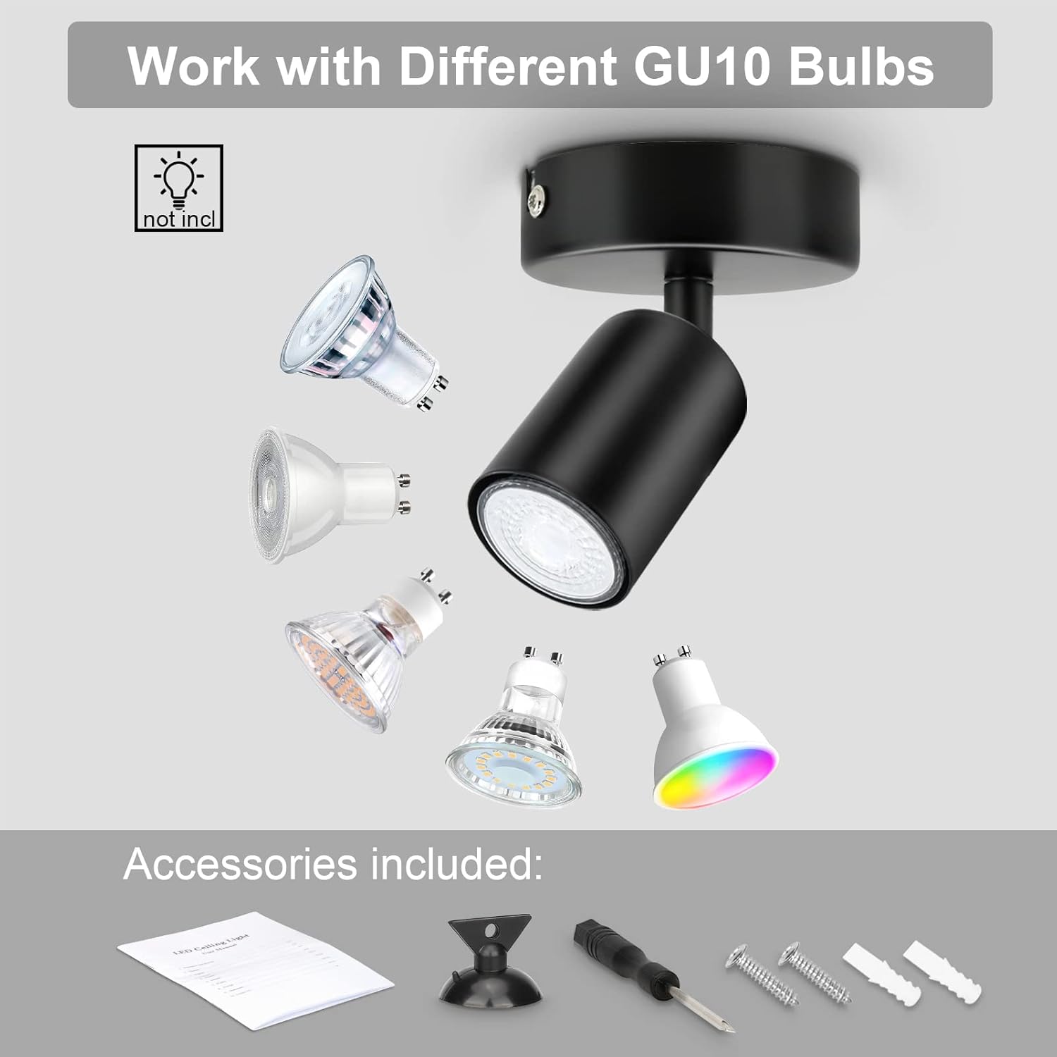 Black spotlight with GU10 bulbs and accessories on a gray background