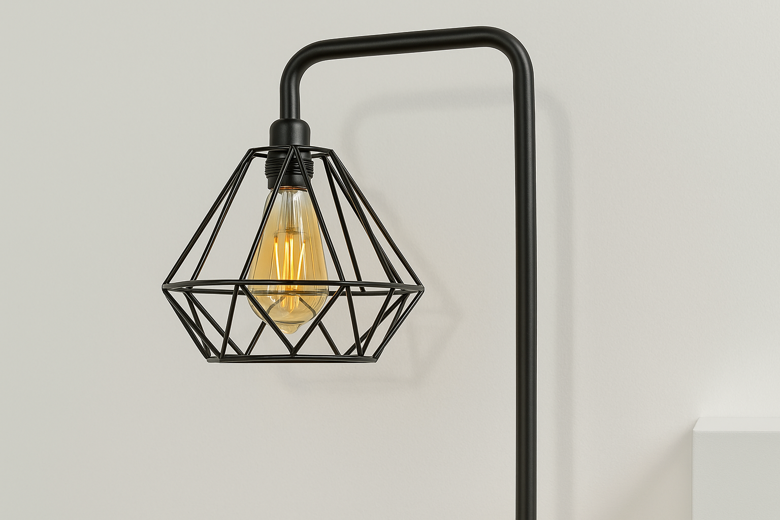 Black wall-mounted lamp with geometric design on a light gray background