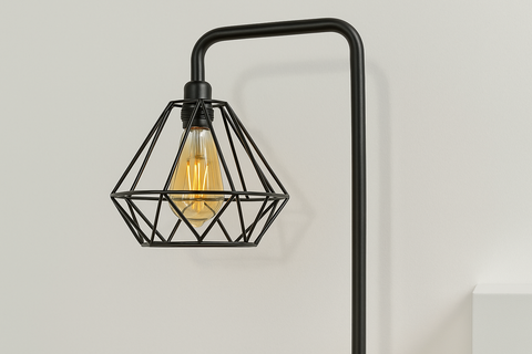 Black wall-mounted lamp with geometric design on a light gray background