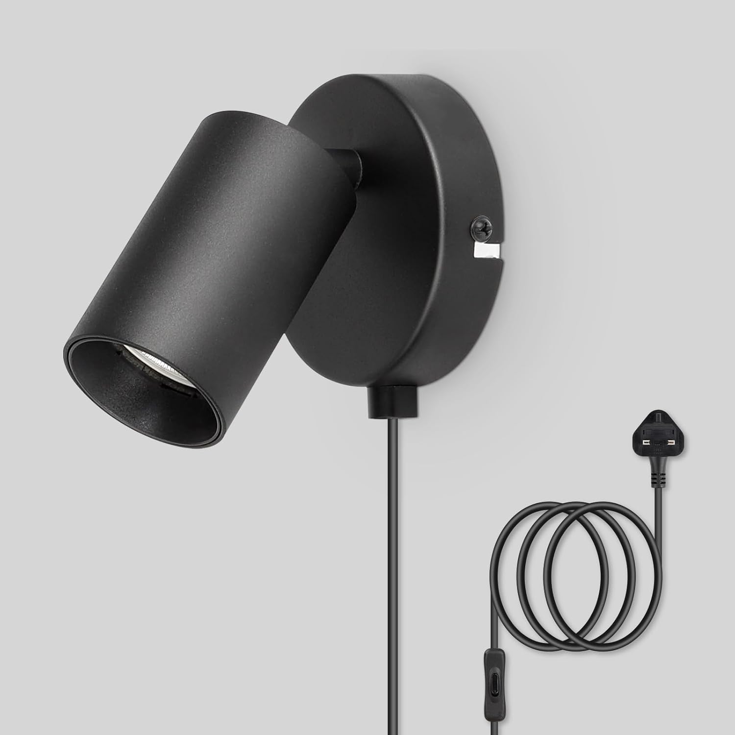 Black wall-mounted lamp with plug on a gray background