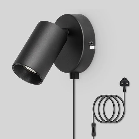 Black wall-mounted lamp with plug on a gray background