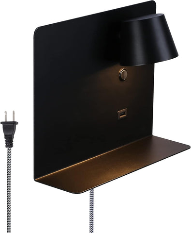 Black wall-mounted lamp with shelf and power cord on a white background