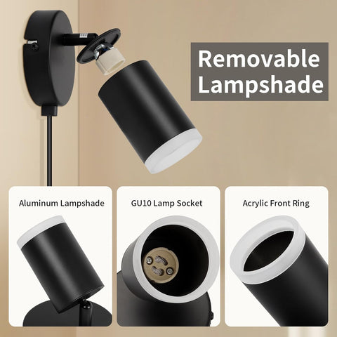 Black wall-mounted light fixture with removable lampshade, showing aluminum lampshade, GU10 lamp socket, and acrylic front ring on a beige background.