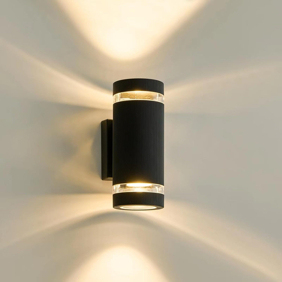 Black wall-mounted outdoor light fixture on a neutral background