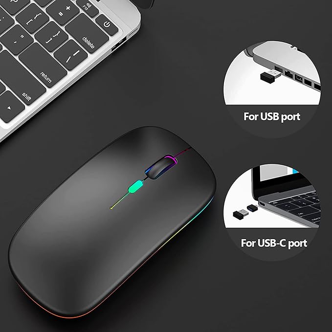 Black wireless mouse with USB and USB-C ports on a dark surface