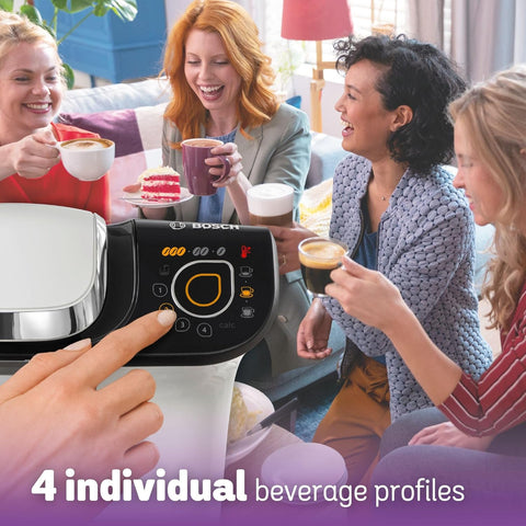 Bosch coffee machine with people enjoying beverages in a cozy living room setting