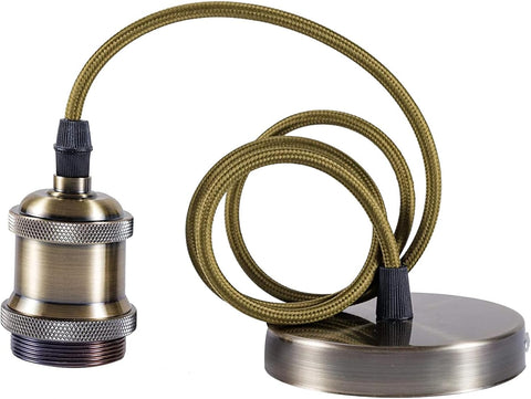 Brass lamp socket with coiled cable on a white background
