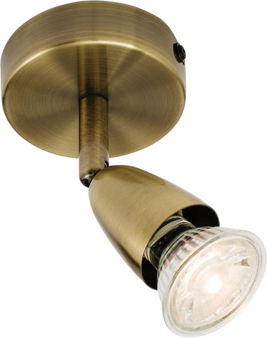 Brass wall light fixture on a white background