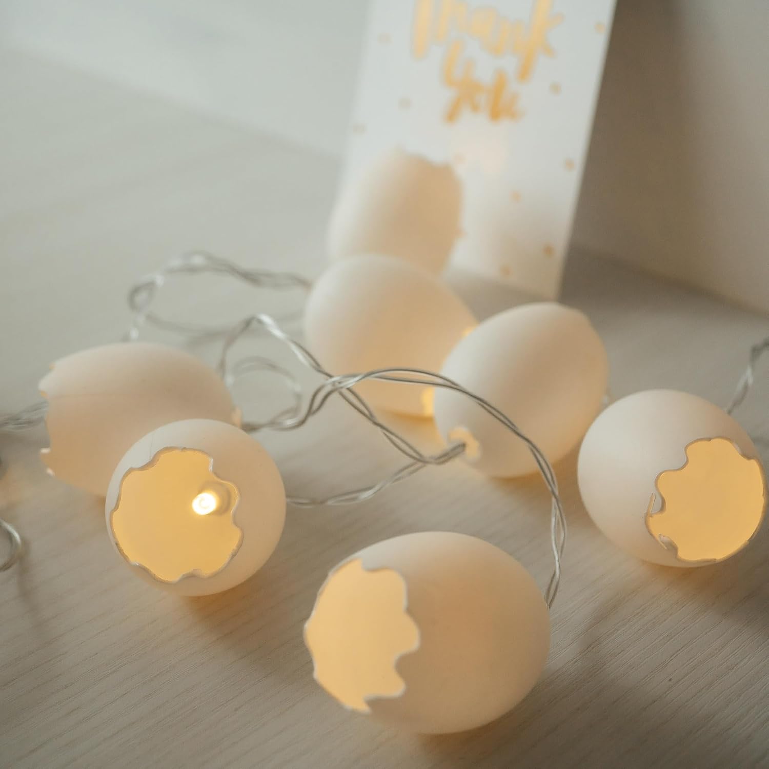 Broken egg LED fairy string lights with warm white glow for Easter décor