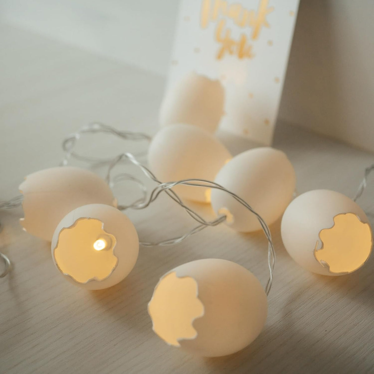 Broken egg LED fairy string lights with warm white glow for Easter décor