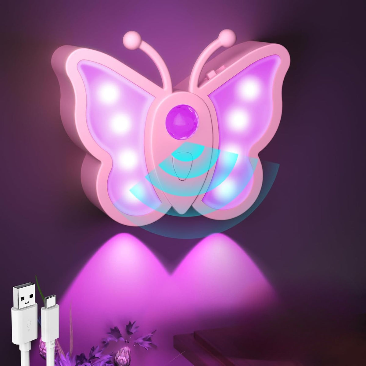 Butterfly-shaped night light with USB cable on a dark background