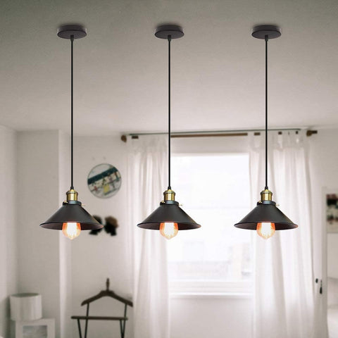 Industrial-style pendant lamp shade hanging over a modern dining table