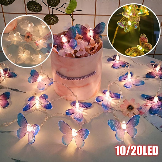 Solar-powered LED butterfly fairy lights glowing in a garden

