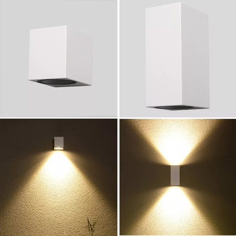 Alpha Lights Modern PVC Wall Light in black finish illuminating a garden wall

